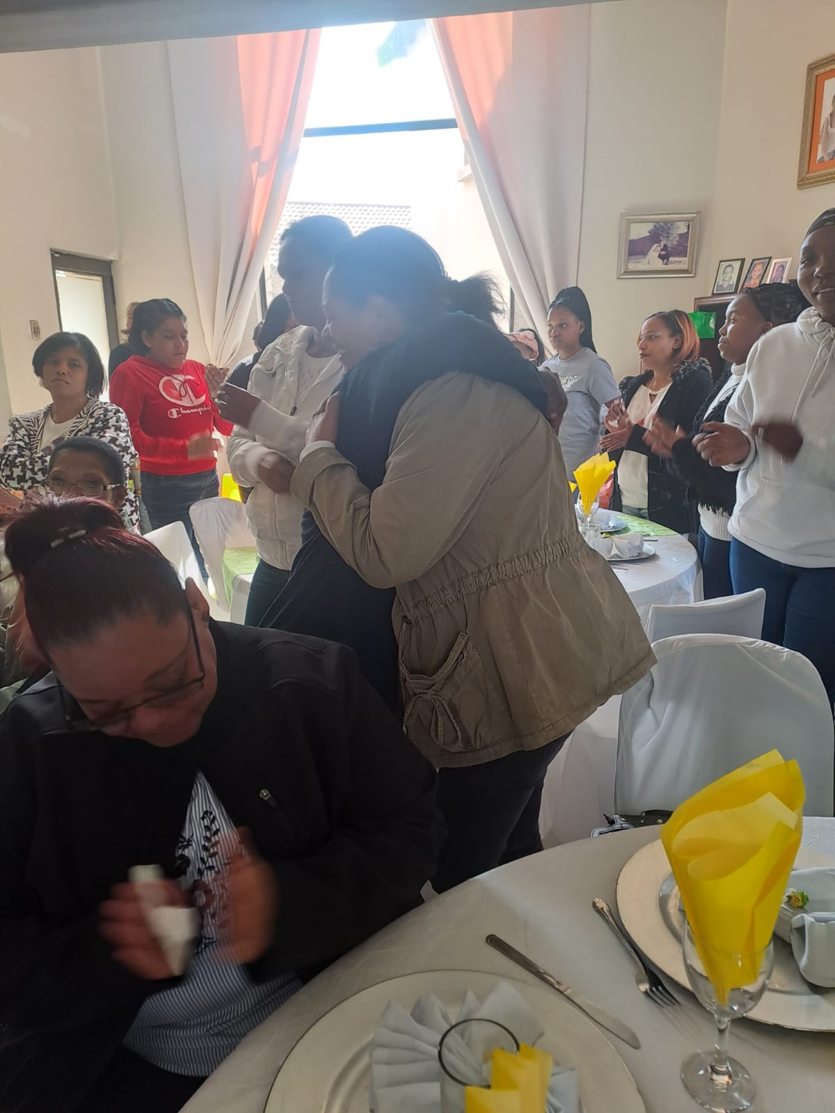 Women embracing and supporting one another